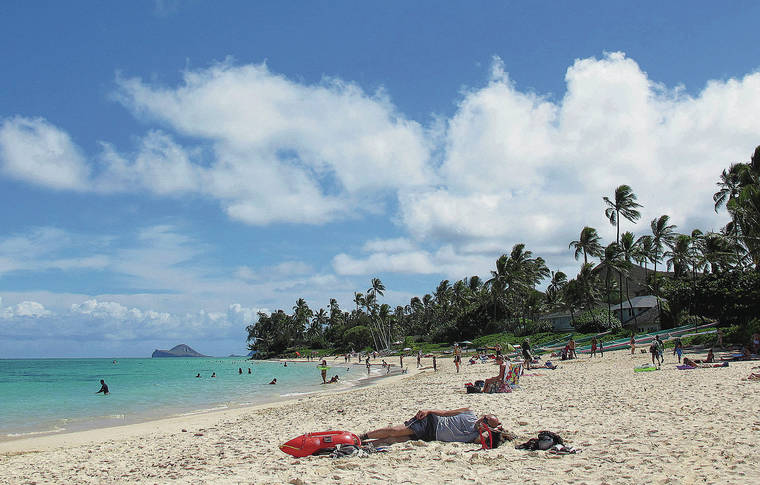 ASSOCIATED PRESS / 2013
                                Airbnb Inc. is agreeing to provide officials with records for many of its Hawaii-based hosts as the state tries to track down vacation rental operators who haven’t been paying their taxes. People sunbathe at Lanikai Beach, in a popular neighborhood for vacation rentals.