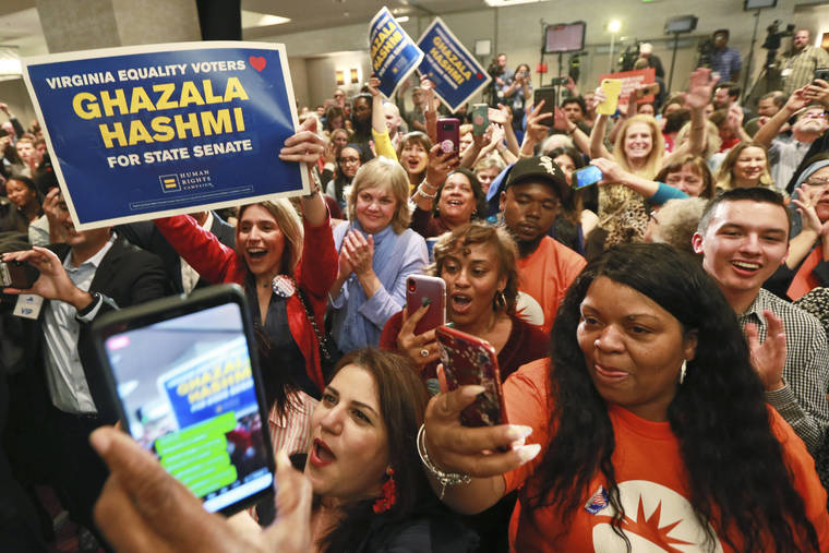 ASSOCIATED PRESS
                                Democratic supporters cheer at their party in Richmond, Va.