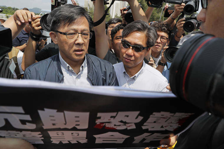 ASSOCIATED PRESS
                                Pro-Beijing lawmaker Junius Ho, left, attended an Aug. 12 demonstration of an anti-riot vehicle equipped with water cannon at the Police Tactical Unit Headquarters in Hong Kong. Hong Kong police say an anti-government supporter stabbed and wounded the pro-Beijing lawmaker who was campaigning for local elections.