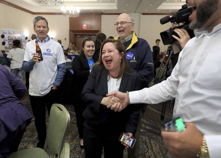 ROB OSTERMAIER/THE VIRGINIAN-PILOT VIA ASSOCIATED PRESS
                                Candidate for the 94th District, Shelly Simonds, celebrated with supporters as election results began to come in Tuesday at the Marriott in Newport News, Va.