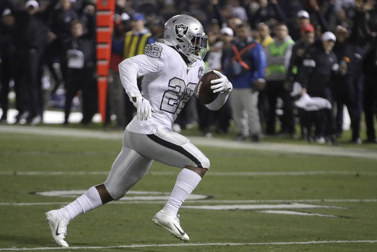 ASSOCIATED PRESS
                                Oakland Raiders running back Josh Jacobs ran on the way to a touchdown against the Los Angeles Chargers during the second half of a game in Oakland, Calif., Thursday.