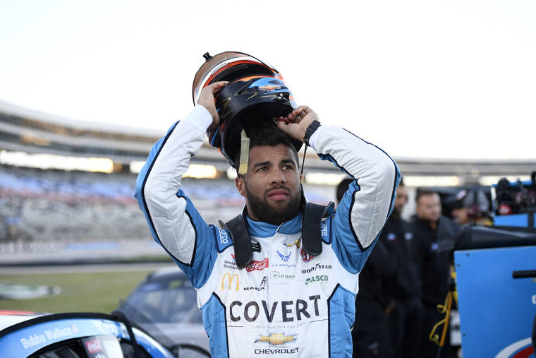 ASSOCIATED PRESS / NOV. 2
                                Bubba Wallace prepares by his car for qualifying for a NASCAR Cup Series auto race at Texas Motor Speedway in Fort Worth, Texas. Wallace was fined $50,000 by NASCAR for causing a caution the week before at Texas that affected the race for at least one playoff driver.