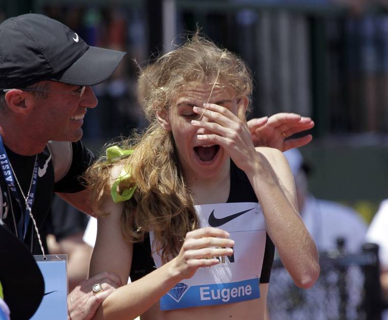 ASSOCIATED PRESS / 2013
                                Mary Cain, 17, right, reacts as coach Alberto Salazar tells her she has just broken the American high school 800-meter record during the Prefontaine Classic track and field meet in Eugene, Ore. Nike will investigate allegations of abuse by runner Mary Cain while she was a member of Alberto Salazar’s training group. Cain joined the disbanded Nike Oregon Project run by Salazar in 2013, soon after competing in the 1,500-meter final at track and field’s world championships when she was 17.