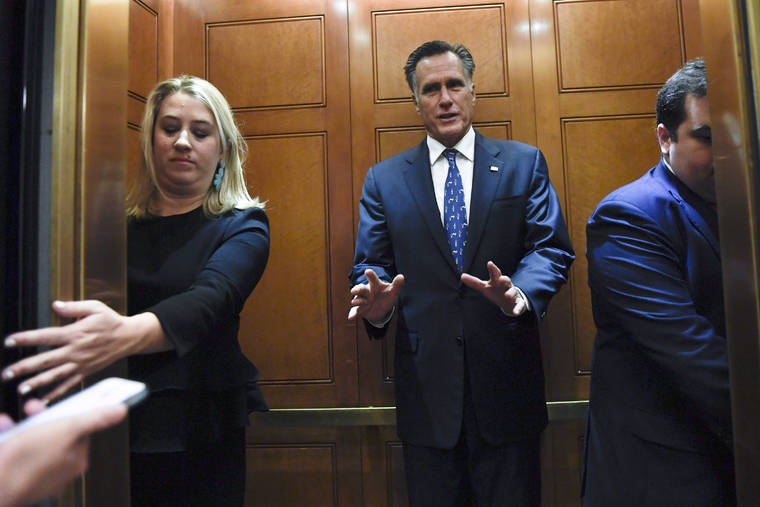 ASSOCIATED PRESS
                                Sen. Mitt Romney, R-Utah, gets in an elevator as he is followed by reporters on Capitol Hill in Washington on Tuesday.