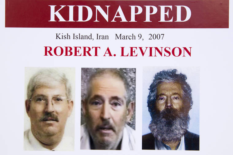 ASSOCIATED PRESS
                                An FBI poster from 2012 shows a composite image of former FBI agent Robert Levinson, right, of how he would look like now after five years in captivity, and an image, center, taken from the video, released by his kidnappers, and a picture before he was kidnapped, left, displayed during a news conference in Washington. Iran is acknowledging for the first time it has an open case before its Revolutionary Court over the 2007 disappearance of a former FBI agent on an unauthorized CIA mission to the country. In a filing to the United Nations, Iran said the case over Robert Levinson was “on going,” without elaborating.