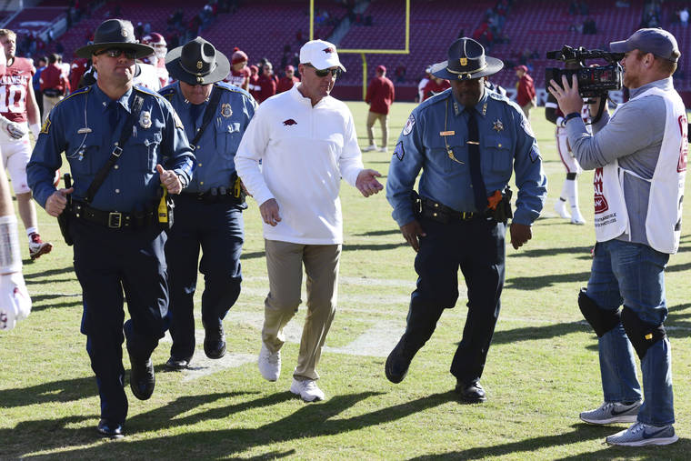 ASSOCIATED PRESS
                                Arkansas coach Chad Morris heads to the locker room after the Razorbacks’ 45-19 loss to Western Kentucky in an NCAA college football game on Saturday in Fayetteville, Ark.