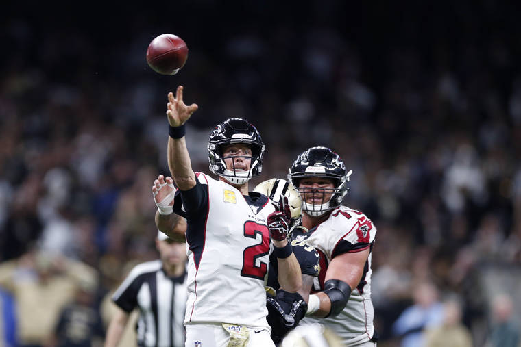 ASSOCIATED PRESS
                                Atlanta Falcons quarterback Matt Ryan (2) throws a touchdown pass to running back Brian Hill, not pictured, in the second half of an NFL football game against the New Orleans Saints in New Orleans, today.