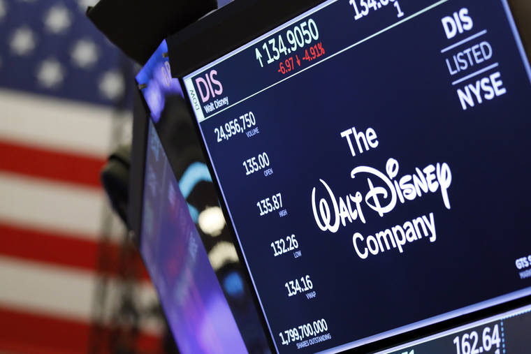 ASSOCIATED PRESS
                                The logo for The Walt Disney Company appeared above a trading post, Aug. 7, on the floor of the New York Stock Exchange. Disney Plus launched its streaming service overnight.