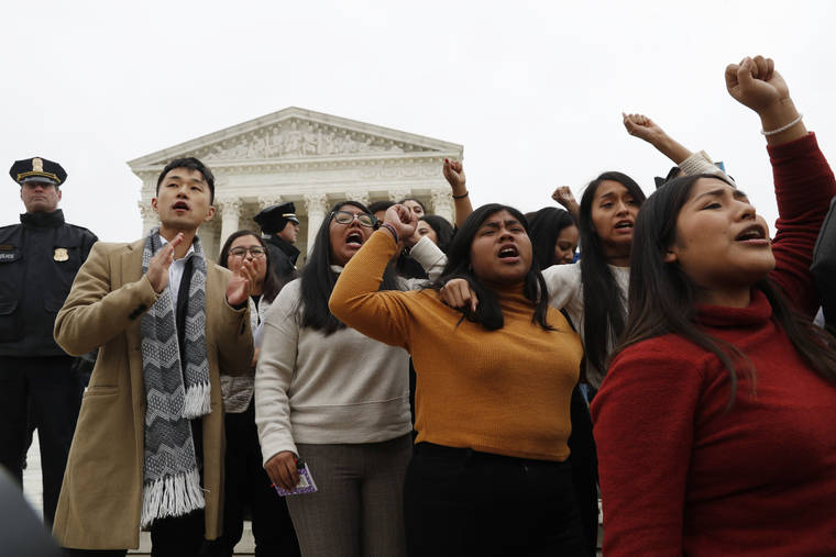 ASSOCIATED PRESS
                                DACA recipients and others leave the Supreme Court with their hands in the air after oral arguments were heard in the case of President Trump’s decision to end the Obama-era, Deferred Action for Childhood Arrivals program (DACA) today at the Supreme Court in Washington.