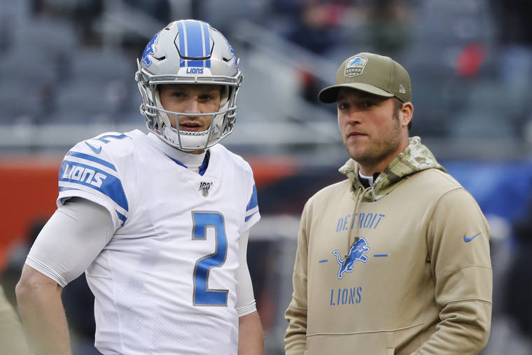ASSOCIATED PRESS
                                Detroit Lions quarterback’s Jeff Driskel (2) and Matthew Stafford watch during warmups before an NFL football game against the Chicago Bears in Chicago on Nov. 10.