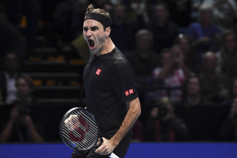 ASSOCIATED PRESS
                                Roger Federer of Switzerland celebrates the winning match point against Novak Djokovic of Serbia during their ATP World Tour Finals singles tennis match at the O2 Arena in London today.