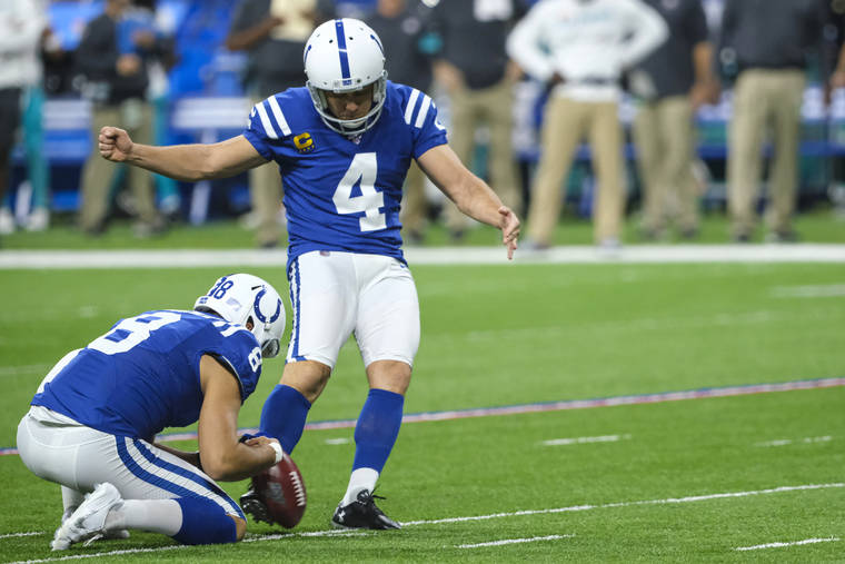 ASSOCIATED PRESS
                                Indianapolis Colts’ Adam Vinatieri (4) kicks a field goal from the hold of Rigoberto Sanchez during the second half of the team’s NFL football game against the Miami Dolphins in Indianapolis on Nov. 10.