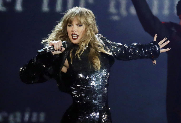 ASSOCIATED PRESS / 2018
                                Taylor Swift performing during her “Reputation Stadium Tour” opener in Glendale, Ariz. Swift says she may not be performing at the American Music Awards because the men who own her old recordings won’t allow her to play her songs.