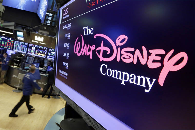 ASSOCIATED PRESS
                                The Walt Disney Co. logo appears on a screen above the floor of the New York Stock Exchange. Disney’s new streaming service, Disney Plus, is adding a disclaimer to some classics because they depict racist stereotypes.