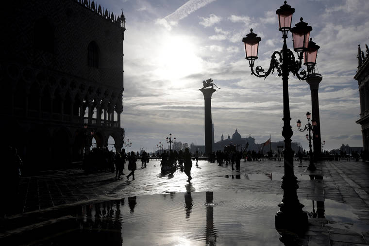 ASSOCIATED PRESS
                                Water starts rising again in Venice, Italy. High tidal waters returned to Venice on Saturday, four days after the city experienced its worst flooding in 50 years.