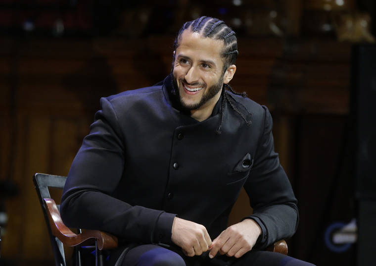 ASSOCIATED PRESS / 2018
                                Former NFL football quarterback Colin Kaepernick smiles on stage during W.E.B. Du Bois Medal ceremonies at Harvard University, in Cambridge, Mass. Kaepernick plans to audition for NFL teams in a private workout arranged by the league to be held in Atlanta.