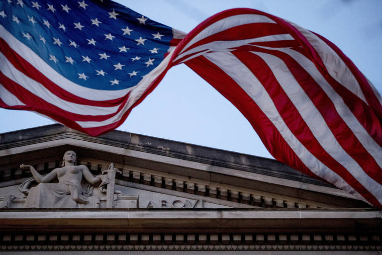 ASSOCIATED PRESS
                                An American flag flew outside the Department of Justice in Washington on March 22. A federal appeals panel is voicing skepticism over the Justice Department’s claim that it can defy Congress’ request for secret material from the Mueller report.