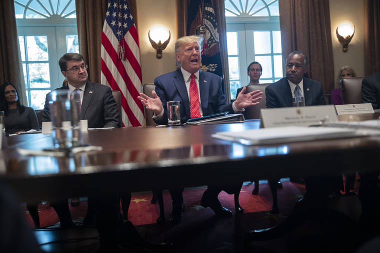 ASSOCIATED PRESS
                                Secretary of Veterans Affairs Robert Wilkie, left, and Secretary of Housing and Urban Development Ben Carson, right, listened as President Donald Trump spoke during a cabinet meeting at the White House, today, in Washington.