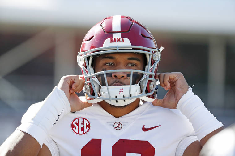 ASSOCIATED PRESS
                                Alabama quarterback Tua Tagovailoa (13) adjusts his helmet before an NCAA college football game against Mississippi State in Starkville, Miss., Saturday.