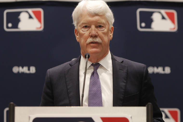 ASSOCIATED PRESS
                                New Kansas City Royals owner John Sherman makes a brief statement to reporters after a baseball owners meeting in Arlington, Texas, today.