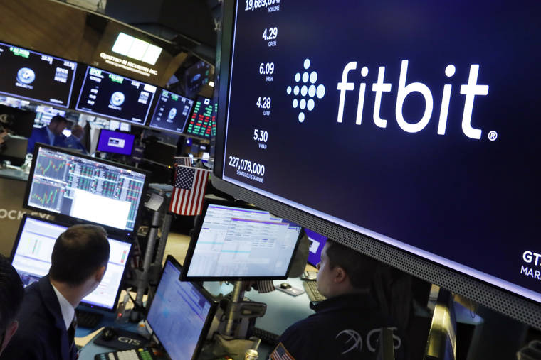 ASSOCIATED PRESS
                                The logo for Fitbit appears above a trading post on the floor of the New York Stock Exchange on Monday.