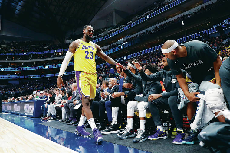 ASOCIATED PRESS
                                Los Angeles Lakers forward LeBron James walks to the bench during an NBA basketball game against the Dallas Mavericks in Dallas, Friday, Nov. 1, 2019.