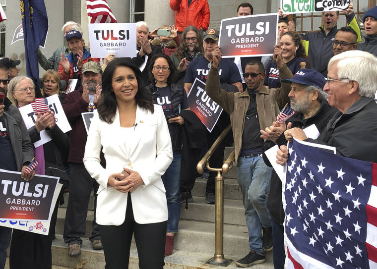 ASSOCIATED PRESS
                                U.S. Rep. Tulsi Gabbard, of Hawaii, center, addresses a crowd outside the New Hampshire Statehouse, in Concord, N.H., on Nov. 5, after signing up to get on the Democratic ballot for New Hampshire’s first-in-the-nation presidential primary, which hasn’t been scheduled yet but is expected to be held Feb. 11, 2020.