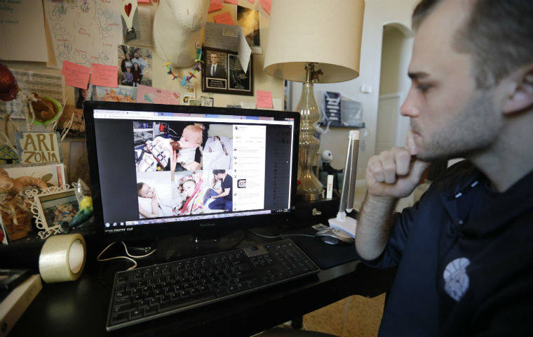 ASSOCIATED PRESS
                                Austin Cloes, a Utah relative of the Americans killed in Mexico, looked at a photo of the children in a hospital who survived the attack, during an interview Tuesday, in Herriman, Utah. Drug cartel gunmen ambushed three SUVs along a dirt road, slaughtering at least six children and three women, all of them U.S. citizens, living in northern Mexico in a grisly attack that left one vehicle a burned-out, bullet-riddled hulk, authorities said Tuesday.