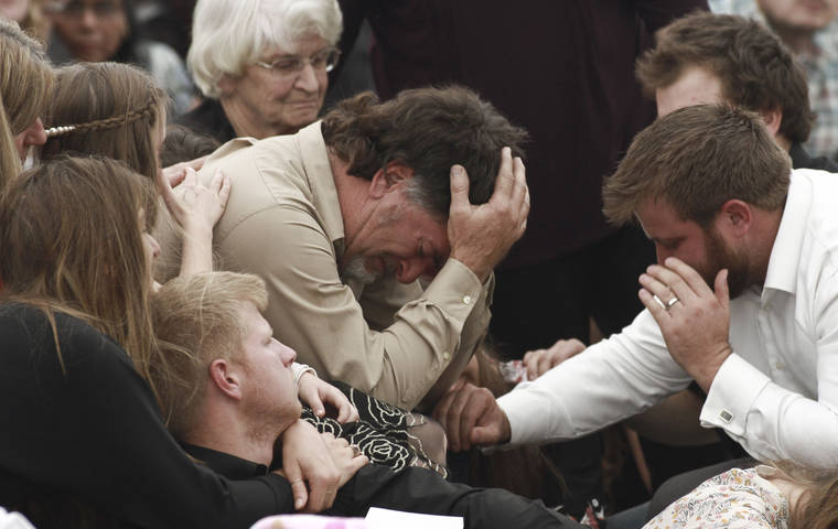 ASSOCIATED PRESS
                                David Langford is consoled during the funeral service for his wife Dawna Ray and their two sons, in La Mora, Mexico, on Thursday.