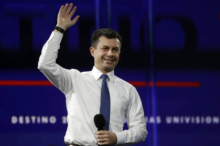 ASSOCIATED PRESS
                                Pete Buttigieg waves during a presidential forum at the California Democratic Party’s convention today in Long Beach, Calif.