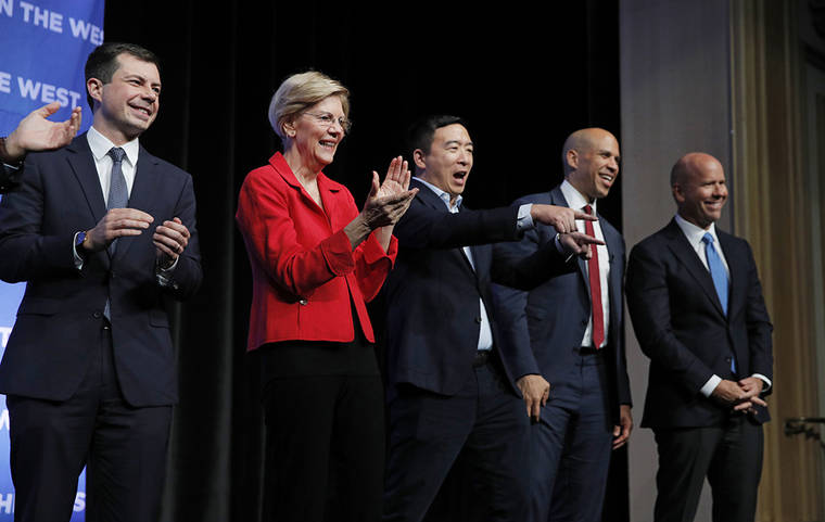 ASSOCIATED PRESS
                                Democratic presidential candidates South Bend, Ind., Mayor Pete Buttigieg, from left, Sen. Elizabeth Warren, D-Mass., businessman Andrew Yang, Sen. Cory Booker, D-N.J., and former Maryland Rep. John Delaney stand onstage during a fundraiser for the Nevada Democratic Party, Sunday, in Las Vegas.