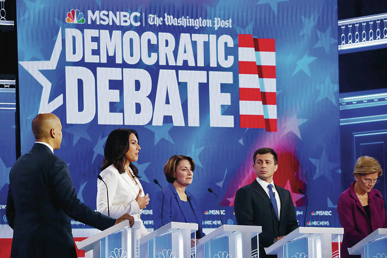 ASSOCIATED PRESS
                                Democratic presidential candidate Rep. Tulsi Gabbard, D-Hawaii, second from left, spoke as other candidates including Sen. Cory Booker, D-N.J., left, Sen. Amy Klobuchar, D-Minn., Mayor Pete Buttigieg of South Bend, Ind., and Sen. Elizabeth Warren, D-Mass., listened during a Democratic presidential primary debate Wednesday in Atlanta.