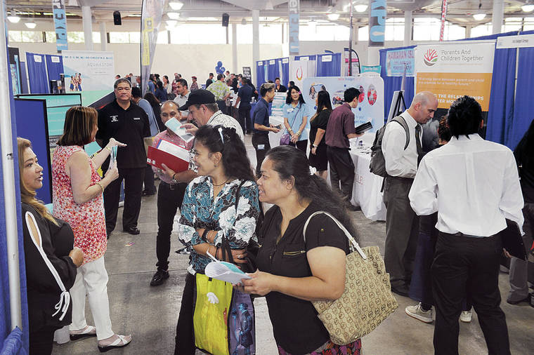 BRUCE ASATO / MARCH 27
                                Job seekers visit booths at the Honolulu Star-Advertiser Career Expo at the Neal Blaisdell Exhibition Hall.