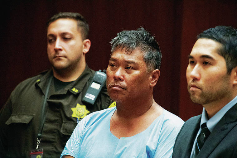 CRAIG T. KOJIMA / CKOJIMA@STARADVERTISER.COM
                                Richard Obrero, center, made his appearance Tuesday at Honolulu District Court. He was charged with second-degree murder in connection with the shooting death of 16-year-old Starsky Willy.