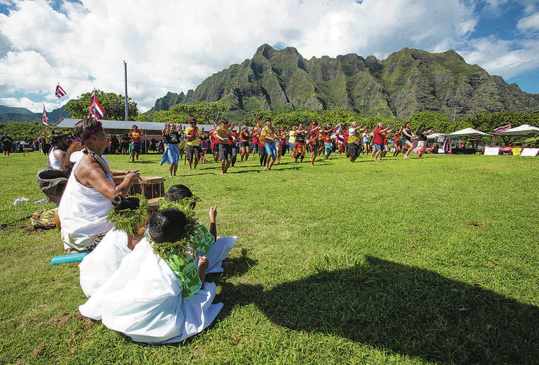 CINDY ELLEN RUSSELL / CRUSSELL@STARADVERTISER.COM
                                People performed hula during a protocol ceremony held at Kualoa Regional Park on Sunday. The gathering was the culminating event of a vehicular convoy, which began in east Kapolei and ended at Kualoa, as a show of solidarity against the construction of the Thirty Meter Telescope on Mauna Kea in Hawaii.