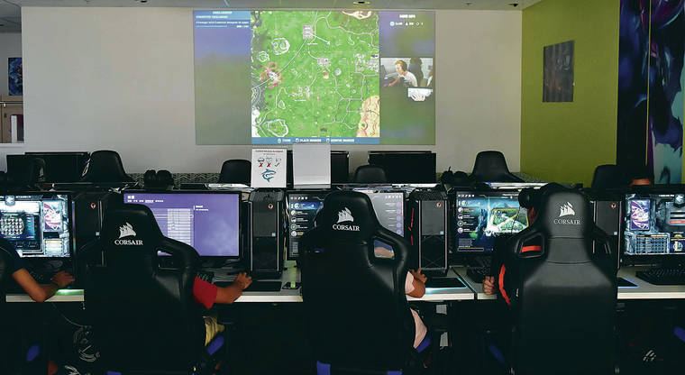 RODNEY S. YAP / SPECIAL TO THE STAR-ADVERTISER
                                Hawaii Pacific University’s eSports Arena, at Aloha Tower Marketplace on Oahu, features cutting-edge gaming rigs, gaming consoles, virtual reality stations, casual seating and viewing areas.
