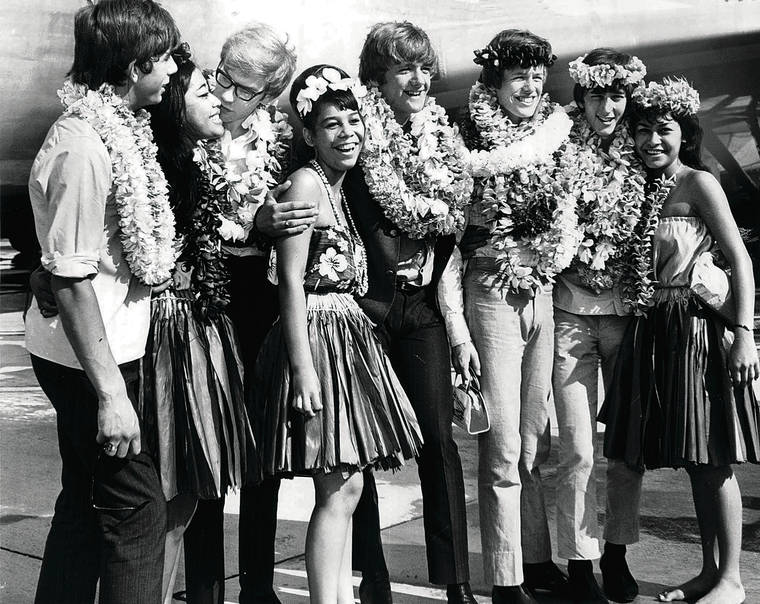 STAR-ADVERTISER
                                Herman’s Hermits posed with several hula girls when they arrived in the islands on Aug. 16, 1965. Peter Noone is third from right.