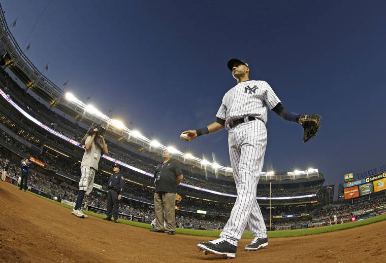ASSOCIATED PRESS
                                New York Yankees shortstop Derek Jeter (2) before the start of a baseball game against the Baltimore Orioles at Yankee Stadium in New York in 2014.