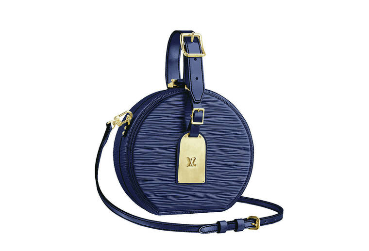 COURTESY LOUIS VUITTON
                                Exclusive items at Louis Vuitton’s Waikiki store include a leather Mini Boite Chapeau bag in a deep purple hue (price available upon request).