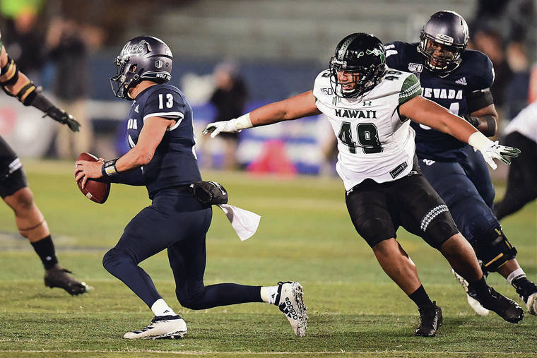 STEVEN ERLER / SPECIAL TO THE STAR-ADVERTISER / SEPT. 28
                                Rainbow Warriors defensive lineman Pumba Williams (49) has teamed with Andrew Choi to replace the production of injured hybrid end, Kaimana Padello.
