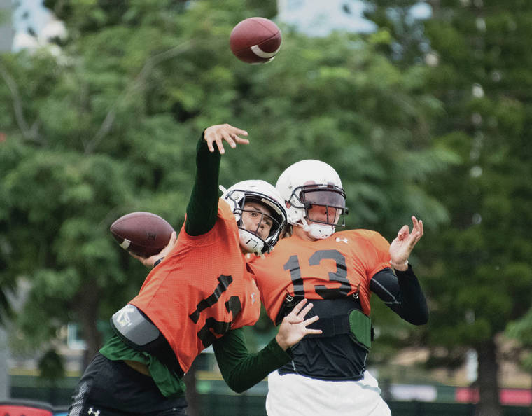 CRAIG T. KOJIMA /CKOJIMA@STARADVERTISER.COM
                                Hawaii quarterbacks Chevan Cordeiro and Cole McDonald say they are fine with sitting if the other player can help them win.