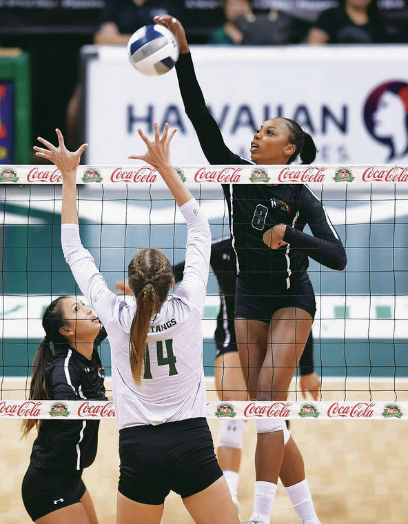 BRUCE ASATO / BASATO@STARADVERTISER.COM
                                Hawaii middle blocker Skyler Williams took a shot off a set from Bailey Choy, left, in the first set against Cal Poly on Sunday at the Stan Sheriff Center.