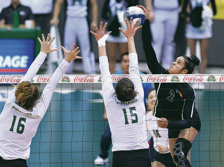 BRUCE ASATO / BASATO@STARADVERTISER.COM
                                Hawaii outside hitter Brooke Van Sickle took a swing against Cal Poly’s Meredith Phillips, left, and Maia Dvoracek in the first set of Sunday’s match.