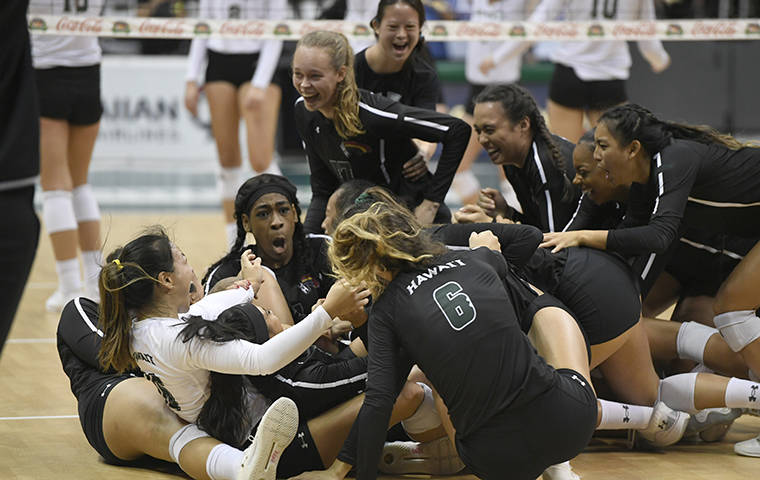 BRUCE ASATO / BASATO@STARADVERTISER.COM
                                Hawaii players celebrate their close win in the fourth set of the Cal Poly vs Hawaii volleyball match at Stan Sheriff Center, UH Manoa, November 3, 2019.