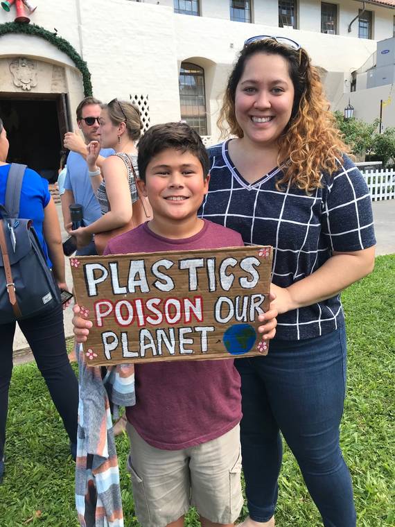 MINDY PENNYBACKER / MPENNYBACKER@STARADVERTISER.COM
                                After speaking in support of Bill 40 at Honolulu Hale this morning, Jaffer Dakroub, 9, posed with his sign and his cousin Lehua Holt.