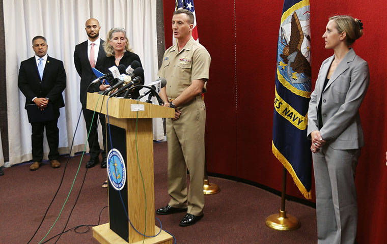 DENNIS ODA / DODA@STARADVERTISER.COM
                                Rear Admiral Robb Chadwick, commander of Navy Region Hawaii, (at the podium) discusses Wednesday’s fatal shooting at the Pearl Harbor Naval Shipyard during a news conference this morning at the Federal Fire Department headquarters near Pearl Harbor.