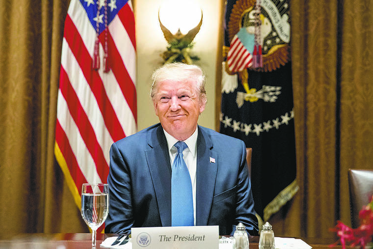 ASSOCIATED PRESS
                                President Donald Trump smiles during a luncheon with members of the United Nations Security Council in the Cabinet Room at the White House in Washington, Dec. 5.