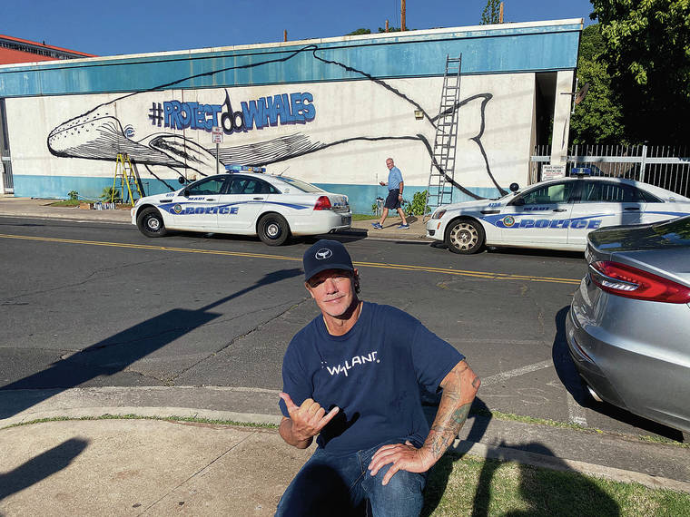 COURTESY WYLAND
                                Painter Robert Wyland posed for a photo Monday with his unauthorized mural of a whale on Dickenson Street in Lahaina, Maui.