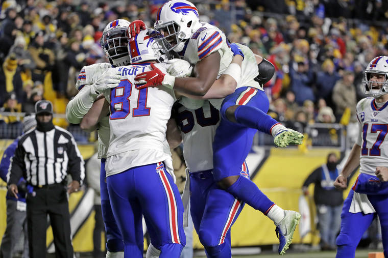 ASSOCIATED PRESS
                                Buffalo Bills tight end Tyler Kroft (81) celebrated with running back Devin Singletary (26) and others after scoring on a pass from quarterback Josh Allen during the second half of a game against the Pittsburgh Steelers in Pittsburgh, Sunday.