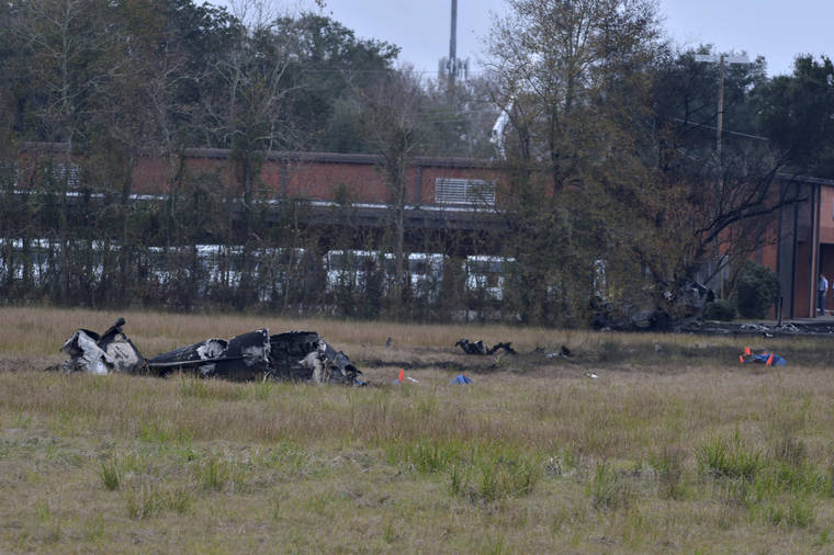 SCOTT CLAUSE/THE LAFAYETTE ADVERTISER VIA AP
                                A view of the burnt wreckage of a plane crash near Feu Follet Road and Verot School Road in Lafayette, La., Saturday, Dec. 28.